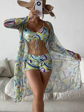 Colorful printed swimsuit with long sleeve cardigan - Fashionable women's summer beach attire featuring a patterned bikini and matching sheer coverup from K-AROLE.