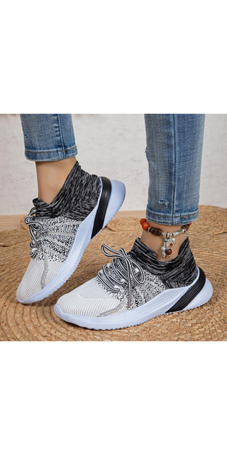 Trendy knit sneakers with a breathable mesh design for active women. Featuring a lace-up closure and a durable sole, these comfortable sports shoes are perfect for running, walking, or casual wear.