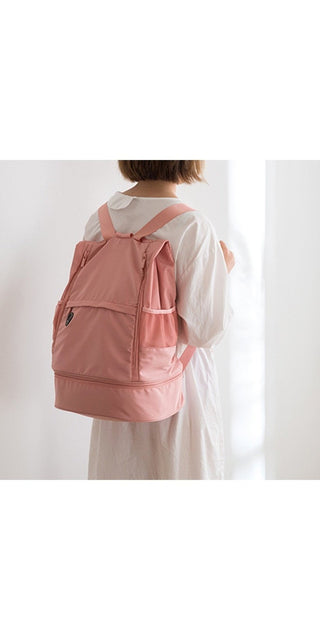 Stylish pink backpack with innovative design for versatile use in sports and travel. Featuring multiple compartments and pockets for organized storage.