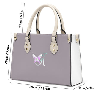 Elegant women's gray and white PU leather handbag with butterfly print design. The tote bag features dual handles, gold-tone hardware, and a stylish, modern silhouette. It appears to be a fashionable accessory from the K-AROLE store, offering trendy and comfortable women's fashion.