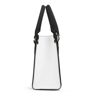 Elegant white and black PU leather tote bag with double handles and zipper closure, perfect for stylish women on the go.