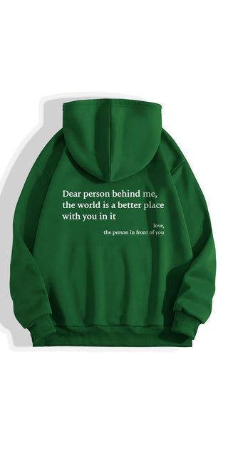 Green hooded sweatshirt with inspirational message "Dear person behind me, the world is a better place with you in it, love, the person in front of you" printed on the back.