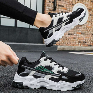 Black and white lace-up sneakers with a sporty, breathable mesh design for men's outdoor and casual wear. Lightweight running shoes with a durable, comfortable construction.