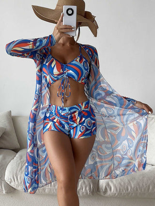 Colorful printed bikini with matching long sleeve cardigan, stylish summer beach outfit.