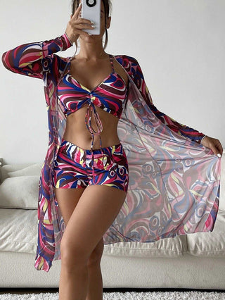 Colorful patterned women's 3-piece swimsuit with long sleeve cover-up featuring a two-piece bikini and coordinating shorts for a stylish beach look.