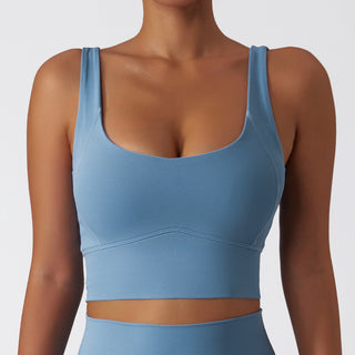 Blue athletic crop top with wide adjustable straps