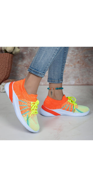Colorful lace-up sports shoes with breathable mesh design, suitable for running, walking, or casual wear.
