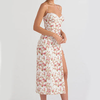 Lace-trimmed floral sundress with thigh-high slit, delicate straps, and elegant floral print design.
