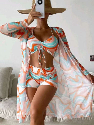 Vibrant patterned bikini and kimono set for chic beachwear style