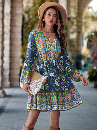 Printed V-Neck Long Sleeve Dress: Stylish floral patterned dress with boho-chic flair, featuring a V-neck and flowing bell sleeves for a feminine, relaxed look.