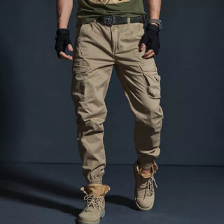 Rugged men's tactical cargo pants with multiple pockets, adjustable waist, and sturdy construction for versatile outdoor wear from K-AROLE.