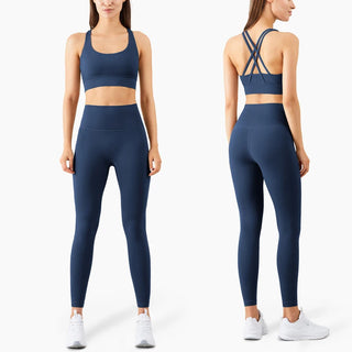 Vibrant navy blue fitness leggings and sports bra set, featuring a sleek and modern design with criss-cross straps on the back of the bra for added style and support. This athletic ensemble is perfect for a variety of workouts, from high-intensity training to yoga and pilates.