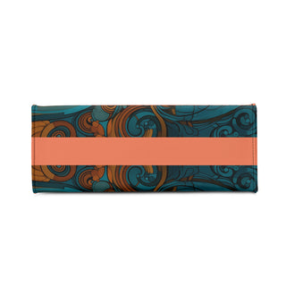 Stylish leather handbag with intricate paisley pattern in teal and orange hues, featuring a bold center panel in a contrasting coral color.