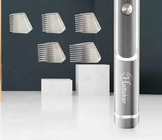 Retractable men's shaver and hair trimmer with multiple attachments displayed on a white surface against a dark gray background.