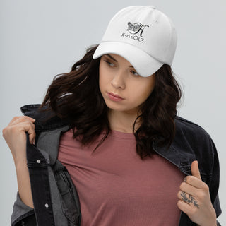 White K-AROLE branded baseball cap with logo on stylish young woman wearing casual clothing against plain background.