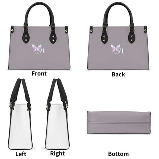 Elegant women's gray and white PU leather handbag with butterfly print design. The tote bag features dual handles, gold-tone hardware, and a stylish, modern silhouette. It appears to be a fashionable accessory from the K-AROLE store, offering trendy and comfortable women's fashion.