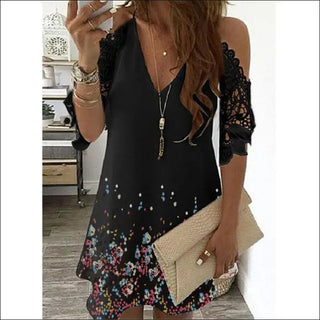 Stylish floral print dress with lace cold-shoulder detail and statement necklace accessory, showcasing fashionable women's apparel.