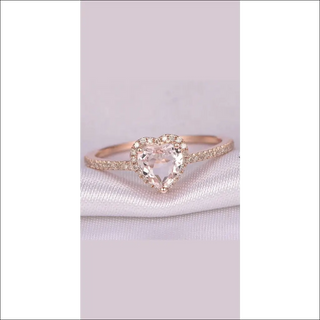 Elegant rose gold heart-shaped wedding ring with sparkling crystals for women's bridal jewelry and party accessories.