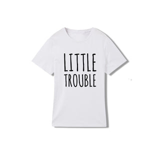 White t-shirt with the text "Little Trouble" printed in black on the front.