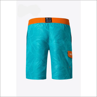 Vibrant palm-printed athletic shorts with contrasting orange waistband and accents, ideal for an active lifestyle.