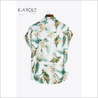 Tropical print curved hem women's shirt with vibrant botanical pattern on display