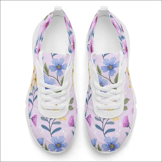 Colorful floral sneakers from K-AROLE. White training shoes with a vibrant floral print pattern featuring pink, purple, and blue flowers along with green leaves. These stylish and supportive sneakers are perfect for women's active lifestyles and workouts.