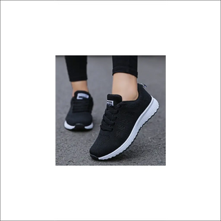 Stylish black mesh sneakers for active women. These comfortable, breathable shoes are perfect for walking, gym workouts, or casual everyday wear. The lightweight, flexible design and non-slip soles provide support and traction. A fashionable and functional addition to a woman's active lifestyle.