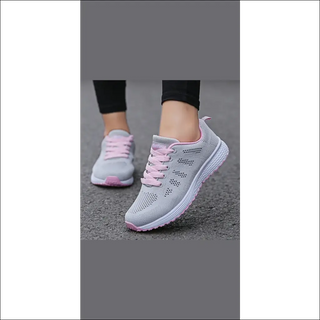 Stylish women's casual mesh sneakers with a breathable design, perfect for walking and gym workouts, featuring a sleek gray and pink color scheme.