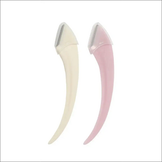 Stylish eyebrow grooming tools for precise, gentle shaping - twin eyebrow trimming knives in elegant ivory and pastel pink hues.