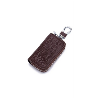 Elegant leather car key holder with zipper closure and keychain, perfect for organizing keys and maintaining an orderly look.