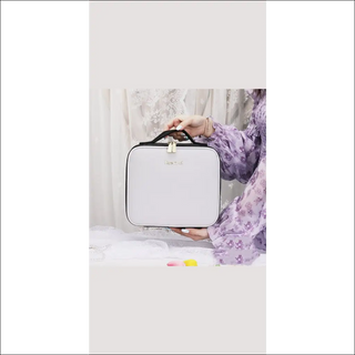 Chic white cosmetic bag with LED lights and mirrored interior, perfect for on-the-go beauty touch-ups.