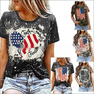 Stylish women's distressed American flag graphic t-shirt with bold text. Trendy fashion top featuring an eye-catching patriotic design perfect for casual summer wear.