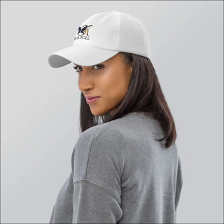 Stylish white K-AROLE dad hat with embroidered logo on model in gray athleisure wear