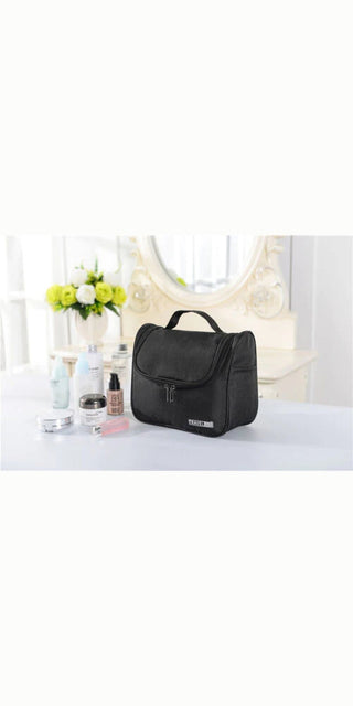 Portable Makeup Travel Organizer Bag - Spacious black toiletry case with various compartments for efficient storage and organization of cosmetics and beauty items during travel.