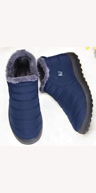 Cozy navy blue winter boots with plush gray lining for women, suitable for cold weather from K-AROLE.