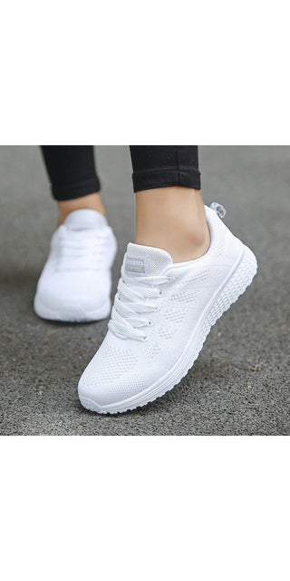 Stylish white women's casual sneakers with breathable mesh design, perfect for comfortable walking and gym workouts. Trendy and versatile footwear from the K-AROLE fashion brand.