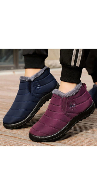 Cozy women's winter boots in navy blue and burgundy, featuring warm lining and anti-slip soles for comfortable walking on snowy terrain.