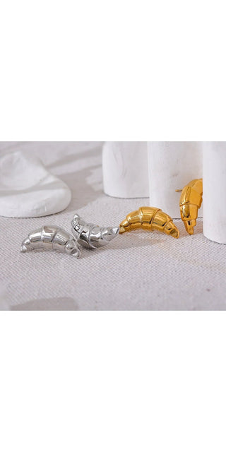 Elegant stainless steel croissant stud earrings with 18K gold plated accents, designed for a fashionable, rust-proof statement jewelry piece.